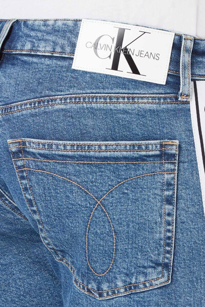 شلوار جین اندامی بغل نوار مردانه آبی روشن برند Calvin Klein